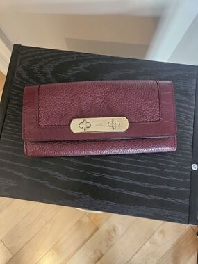 Coach Pebbled Leather Turnlock Wallet in Plum